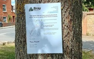 picture of notice on tree